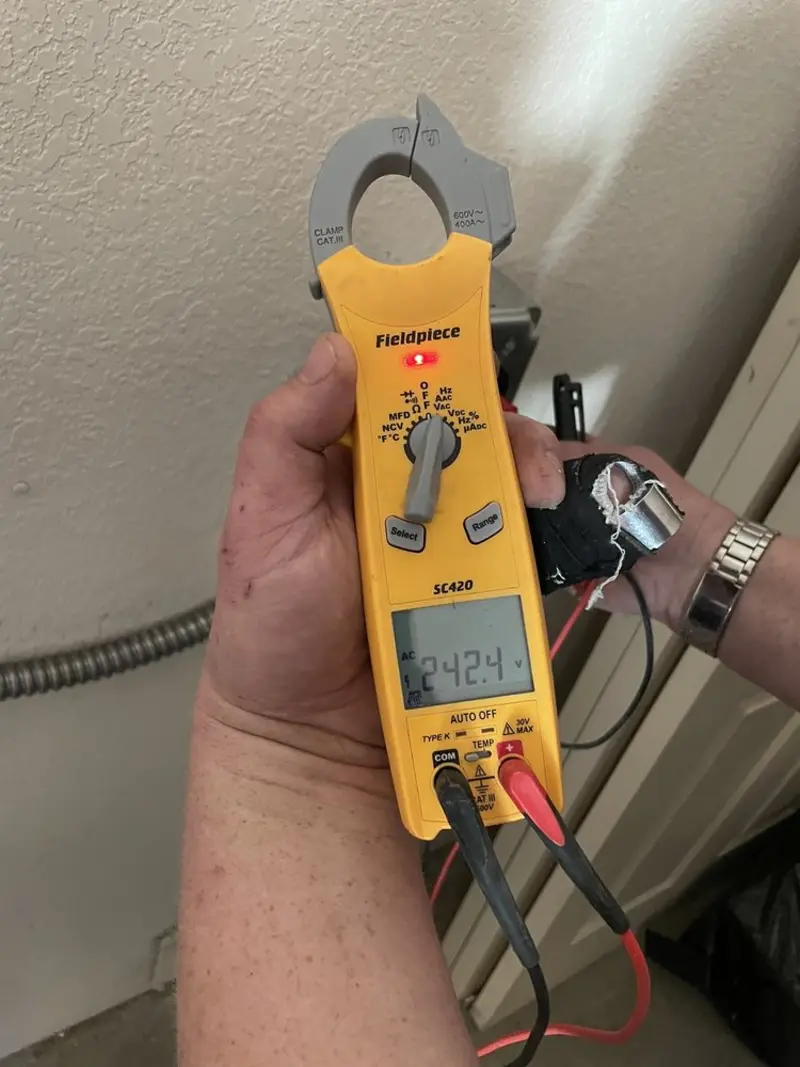 Voltage testing with clamp meter during Generator Installation in Lansing